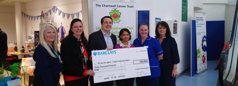 Giving the £30,000 cheque to the hospital